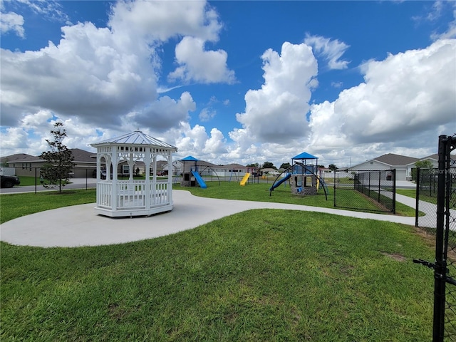 view of property's community featuring a lawn, a gazebo, and a playground