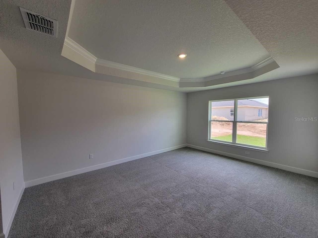 8309 SW 58th Ave, Ocala, FL 34476 - empty room featuring a tray ceiling, crown molding, a textured ceiling, and carpet floors
