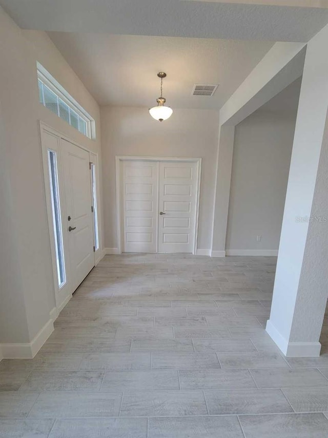 8309 SW 58th Ave, Ocala, FL 34476 - foyer with baseboards and light wood finished floors