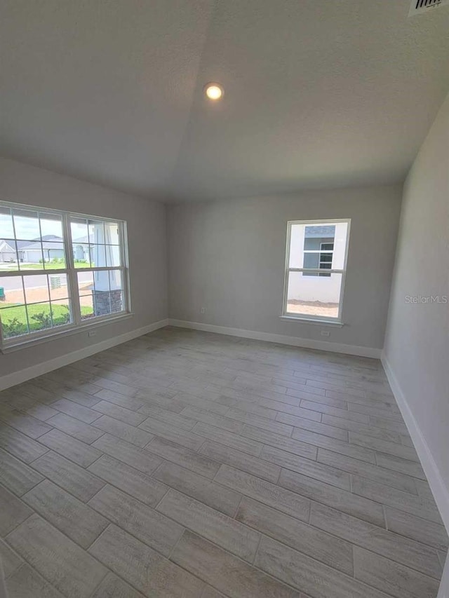8309 SW 58th Ave, Ocala, FL 34476 - unfurnished room with wood finished floors, recessed lighting, and a textured ceiling
