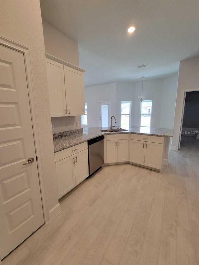 8309 SW 58th Ave, Ocala, FL 34476 - kitchen featuring dishwasher, light wood finished floors, a peninsula, white cabinets, and recessed lighting