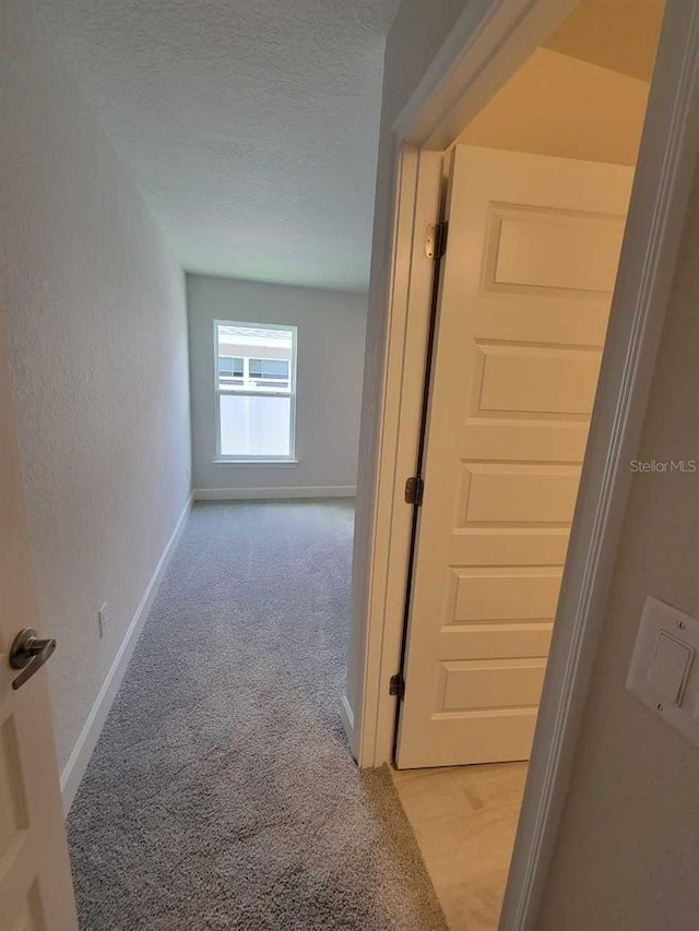 8309 SW 58th Ave, Ocala, FL 34476 - hall featuring light carpet and a textured ceiling
