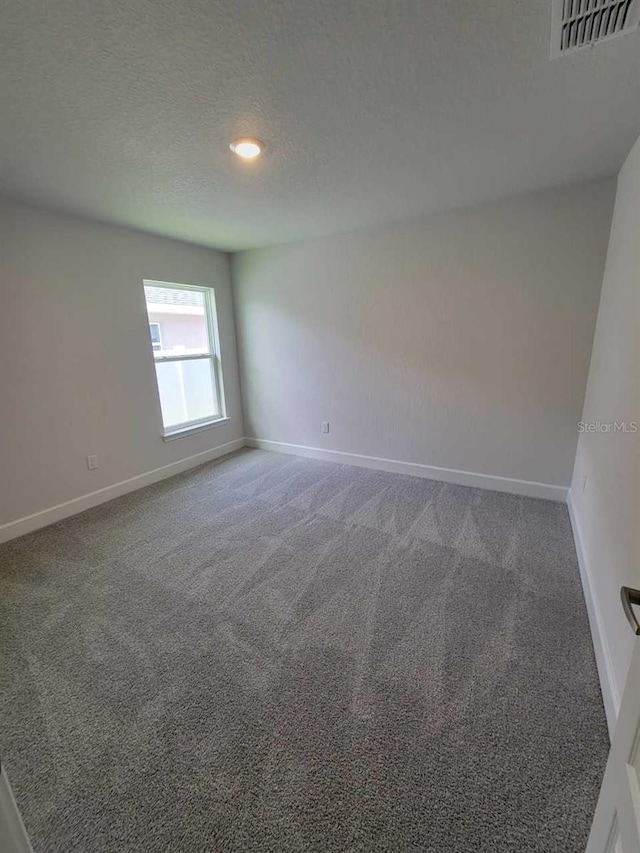 8309 SW 58th Ave, Ocala, FL 34476 - unfurnished room featuring carpet floors, a textured ceiling, and recessed lighting