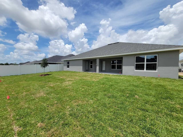 8309 SW 58th Ave, Ocala, FL 34476 - rear view of house with stucco siding and roof with shingles