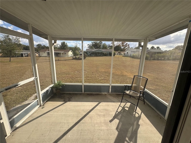 unfurnished sunroom featuring wooden ceiling