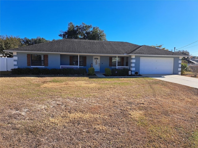 single story home with a front lawn, covered porch, and a garage