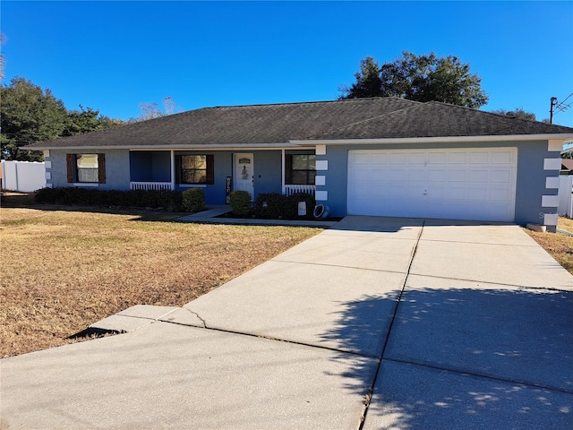 single story home with a front lawn and a garage