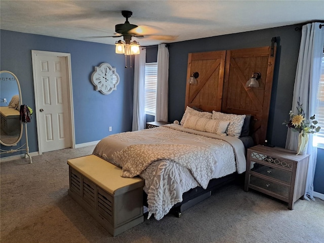 bedroom with carpet flooring, multiple windows, and ceiling fan