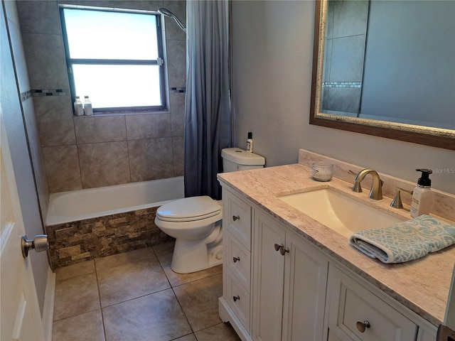 full bathroom featuring tile patterned flooring, vanity, toilet, and shower / bath combo with shower curtain