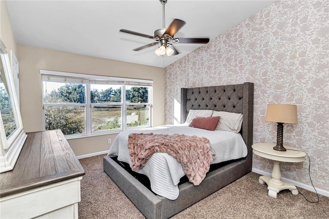 bedroom featuring carpet, ceiling fan, and multiple windows