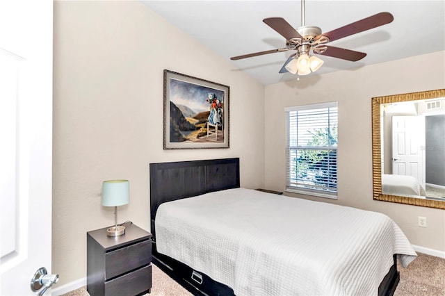 bedroom with carpet flooring, ceiling fan, and vaulted ceiling