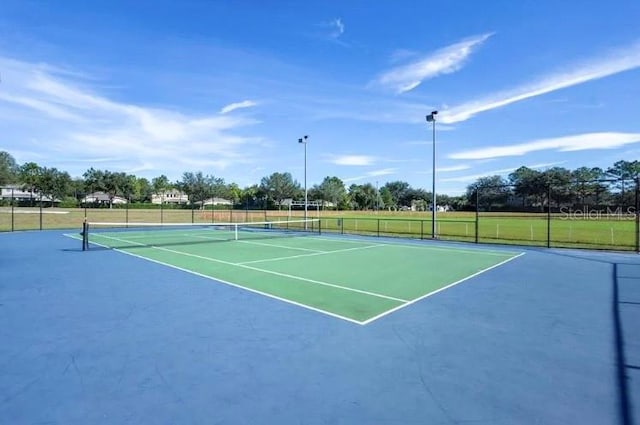 view of tennis court with basketball court