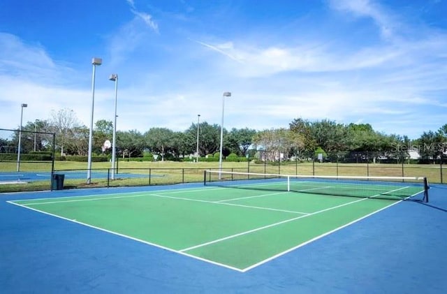 view of sport court with basketball hoop