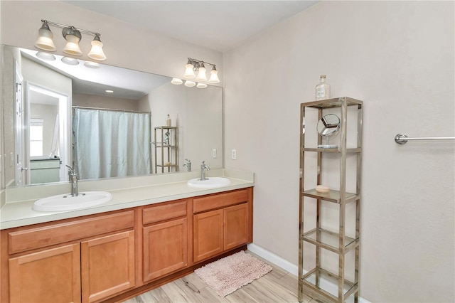 bathroom featuring vanity and hardwood / wood-style flooring