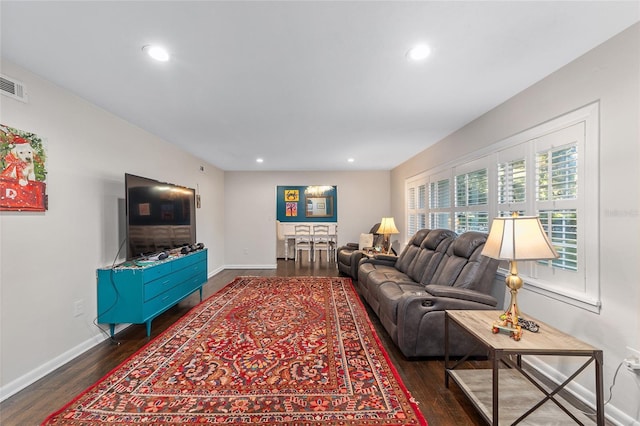 living room with dark hardwood / wood-style floors