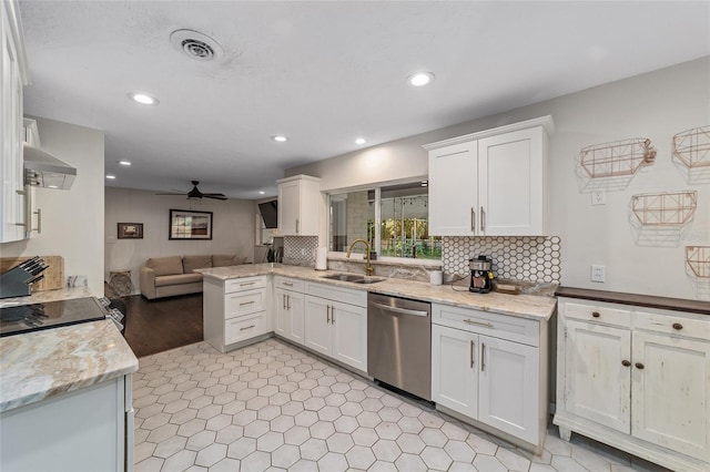 kitchen featuring white cabinetry, stainless steel dishwasher, ceiling fan, and sink