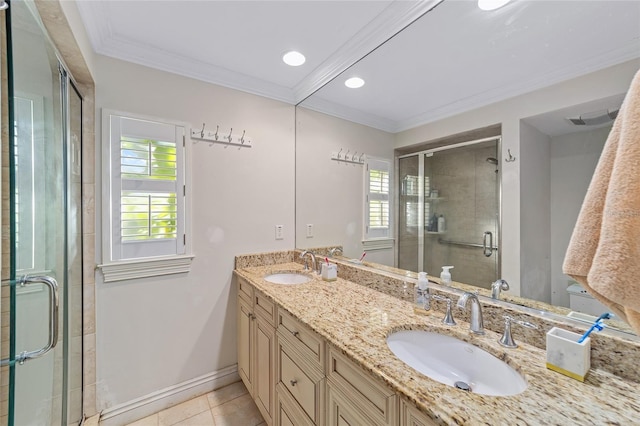 bathroom with tile patterned flooring, vanity, ornamental molding, and walk in shower