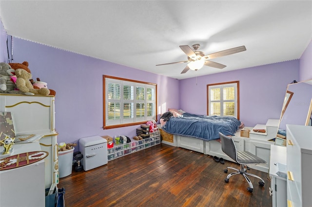 bedroom with ceiling fan and dark wood-type flooring