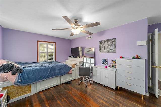 bedroom featuring ceiling fan and dark hardwood / wood-style floors