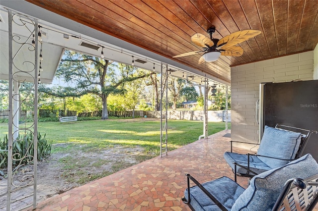 view of patio / terrace featuring ceiling fan