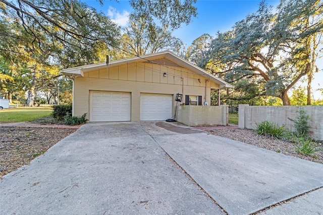 view of side of home featuring a garage