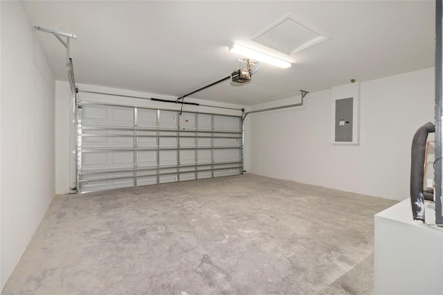 garage featuring a garage door opener and electric panel