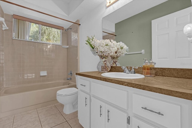 full bathroom with tile patterned floors, vanity, toilet, and tiled shower / bath