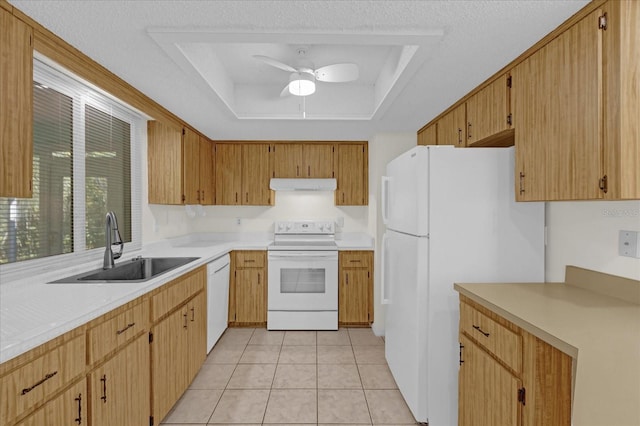 kitchen with white appliances, ventilation hood, a raised ceiling, sink, and ceiling fan