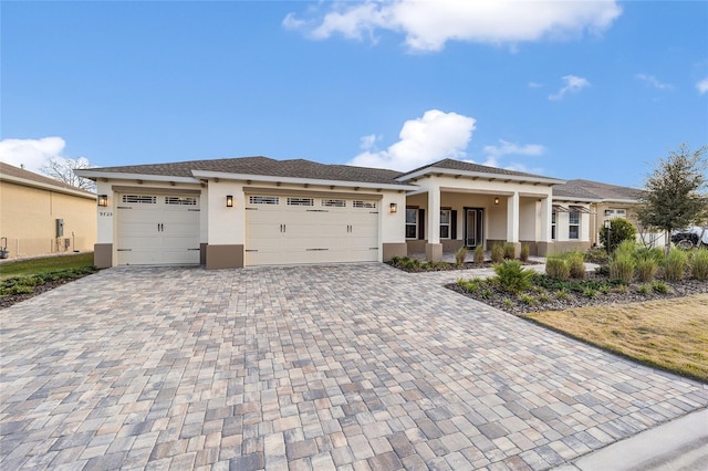 prairie-style home featuring a garage