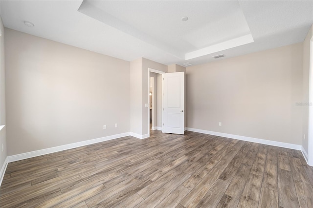 spare room with hardwood / wood-style flooring