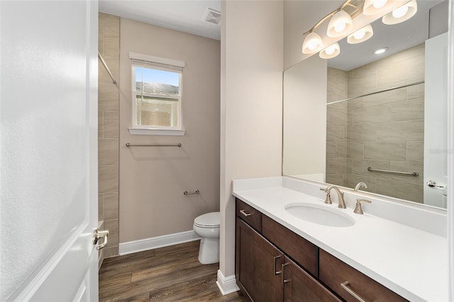 bathroom featuring hardwood / wood-style floors, vanity, and toilet