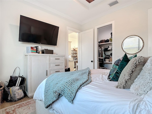 bedroom featuring light hardwood / wood-style flooring and a closet