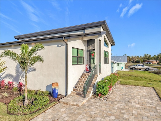 view of home's exterior featuring a yard