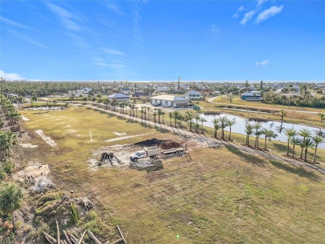 drone / aerial view with a rural view and a water view