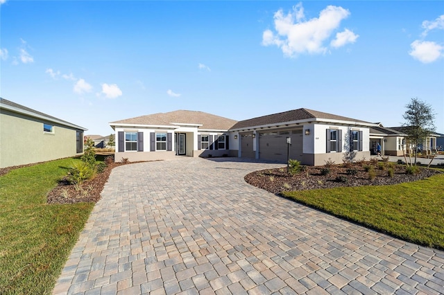 ranch-style house with a front lawn and a garage