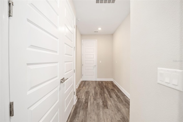 hallway featuring wood-type flooring