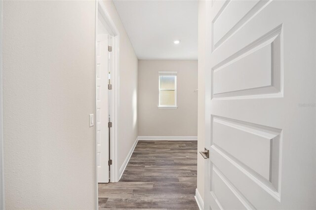 corridor with wood-type flooring