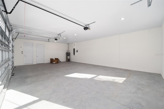 garage featuring a garage door opener and water heater