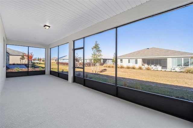 unfurnished sunroom with plenty of natural light