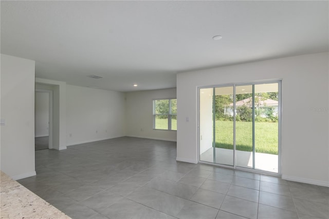 view of tiled spare room