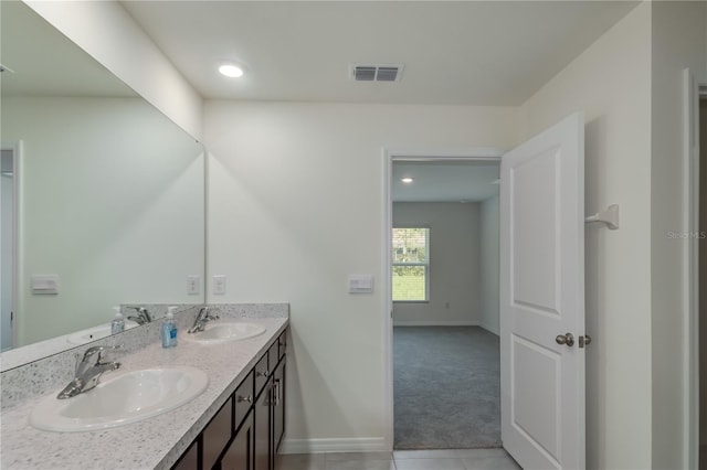 bathroom featuring tile patterned floors and vanity