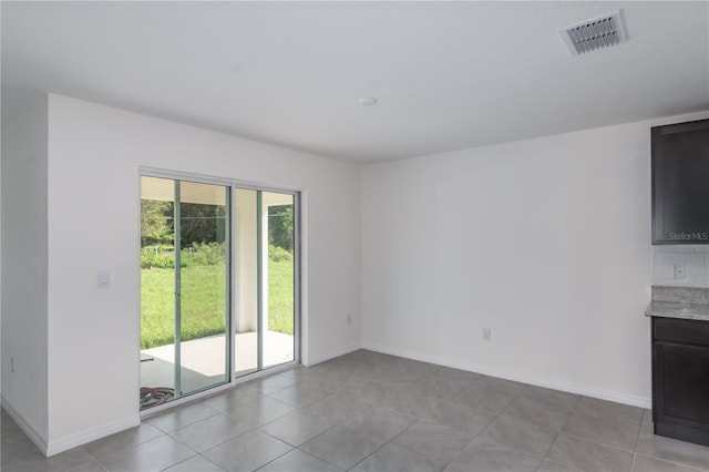 interior space featuring light tile patterned flooring