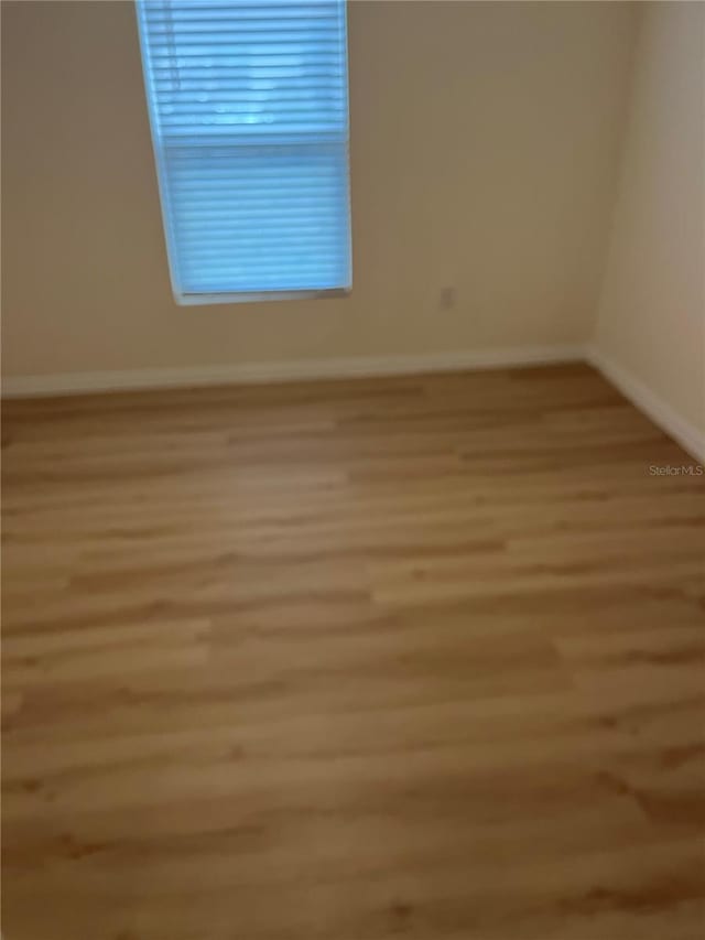 unfurnished room featuring light hardwood / wood-style flooring