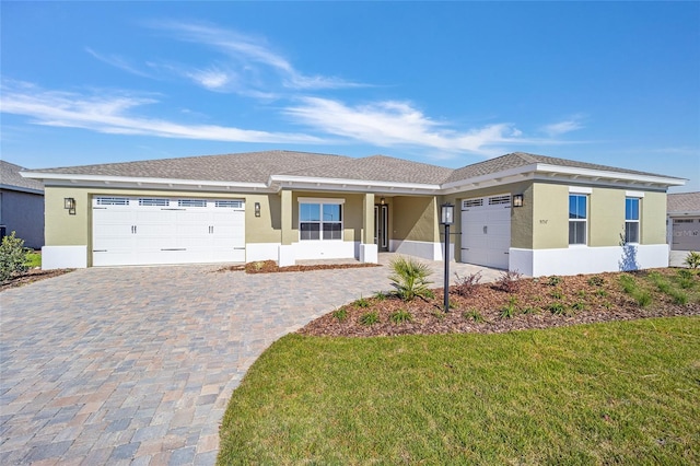 view of front facade with a front lawn and a garage