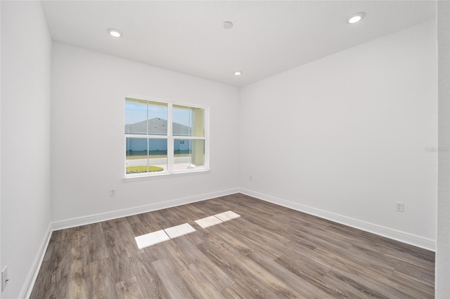 unfurnished room featuring wood-type flooring