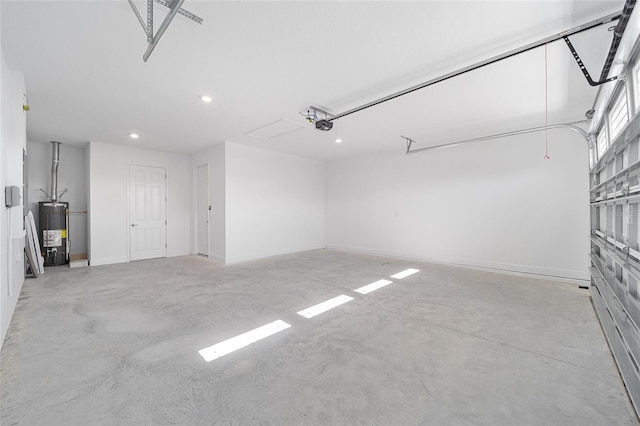 garage featuring gas water heater and a garage door opener