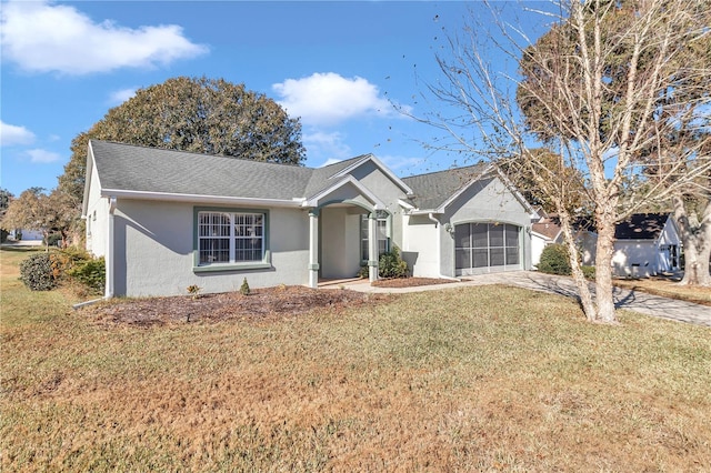 ranch-style home with a front lawn and a garage