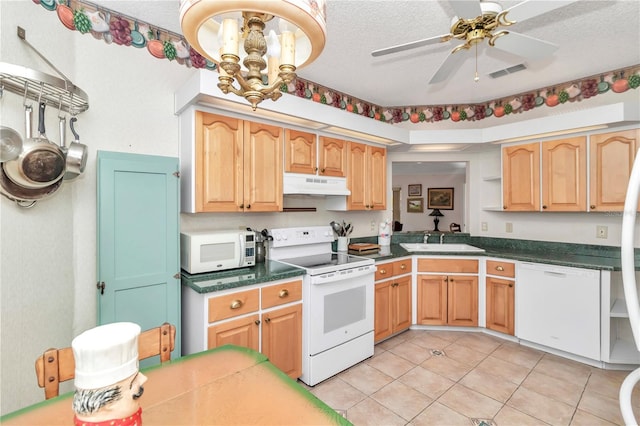 kitchen featuring a textured ceiling, ceiling fan with notable chandelier, white appliances, and sink