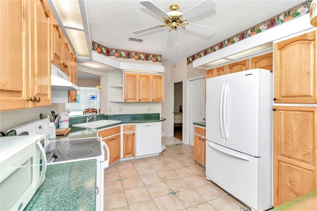 kitchen featuring a textured ceiling, white appliances, sink, and light brown cabinetry