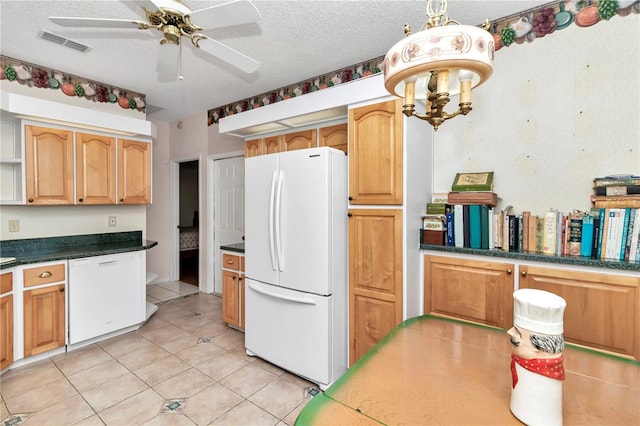 kitchen featuring pendant lighting, white appliances, ceiling fan, light tile patterned floors, and a textured ceiling